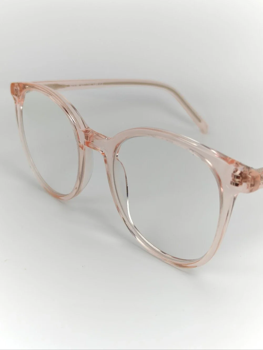 Noun. Transparent Pink Round Women's Eyeglasses. Minimalist..